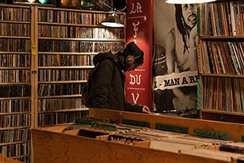 a person browsing the vinyl selection in the shop