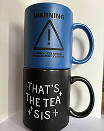 a blue and a black mug stacked on top of each other