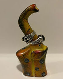a ring holder designed to look like an elephant from the side with two rings stacked on it