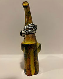 a ring holder designed to look like an elephant from the ront with two rings stacked on it