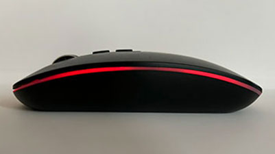 black wireless mouse shown from the side with small red line of light on the outline of the mouse